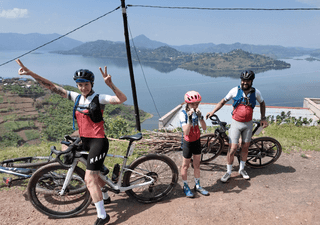 Family cycling together on a scenic route